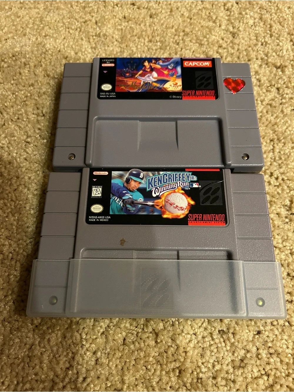 Nintendo Super Nintendo Game Cartridges  Ken Griffey Baseball and Aladdin.